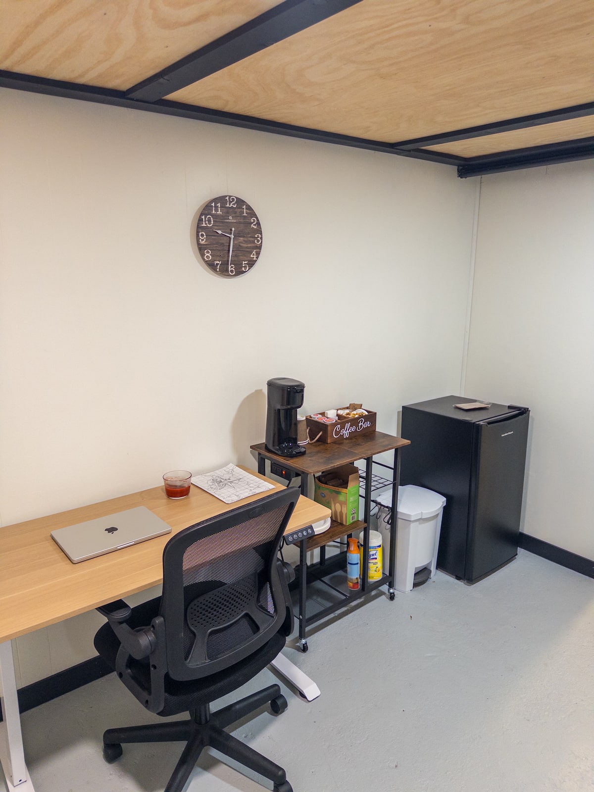 Dedicated workspace and coffee bar with mini fridge